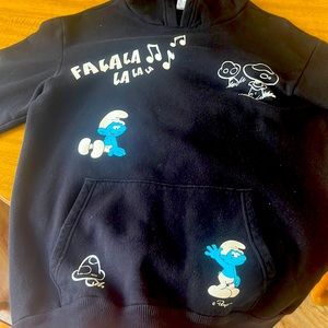 this is a hoodie i’m really good shape. it’s a medium and has Smurf’s all over
